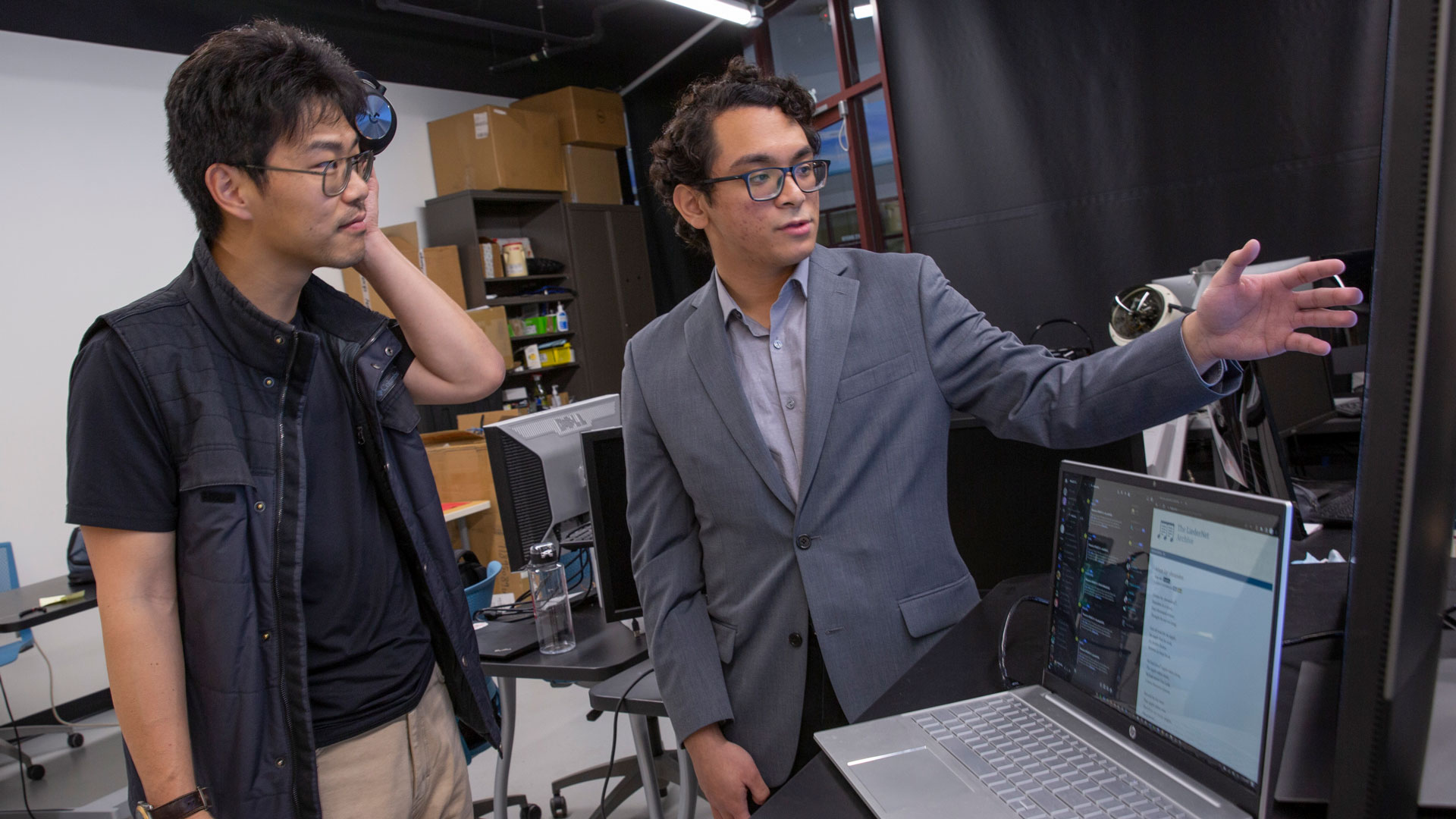 Assistant Professor Yezhou Yang and computer science major Benjamin Joseph L. Herrera