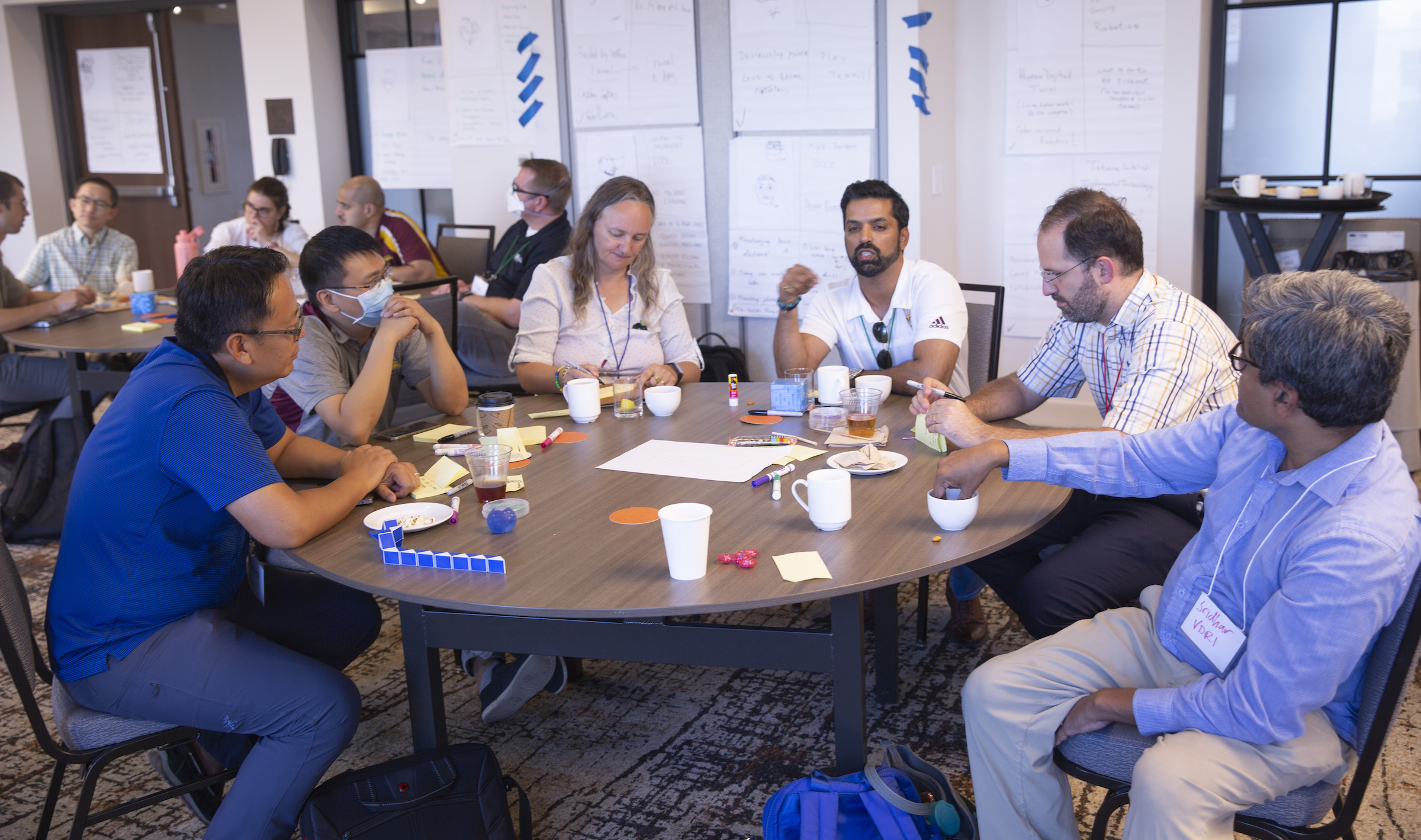 faculty members working together at a table