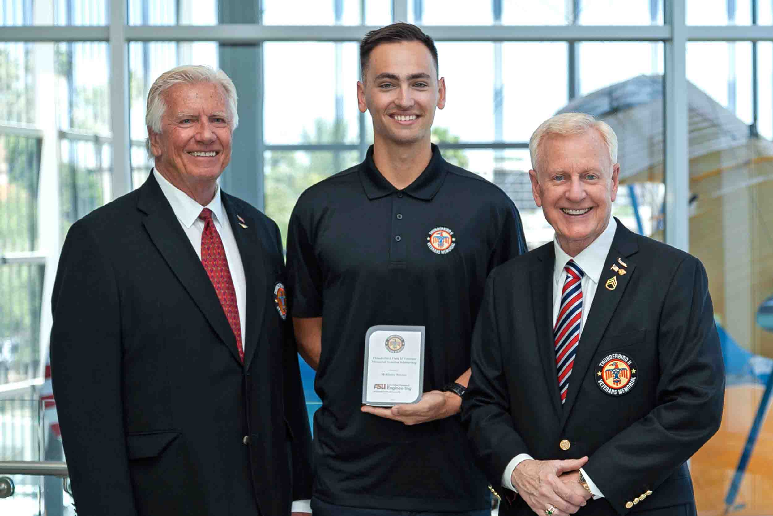 Aeronautical management technology student McKinley Richie accepts the Thunderbird Field II Veterans Memorial Scholarship.